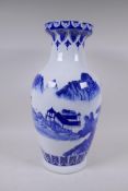 A Chinese blue and white porcelain vase decorated with a riverside landscape, 45cm high