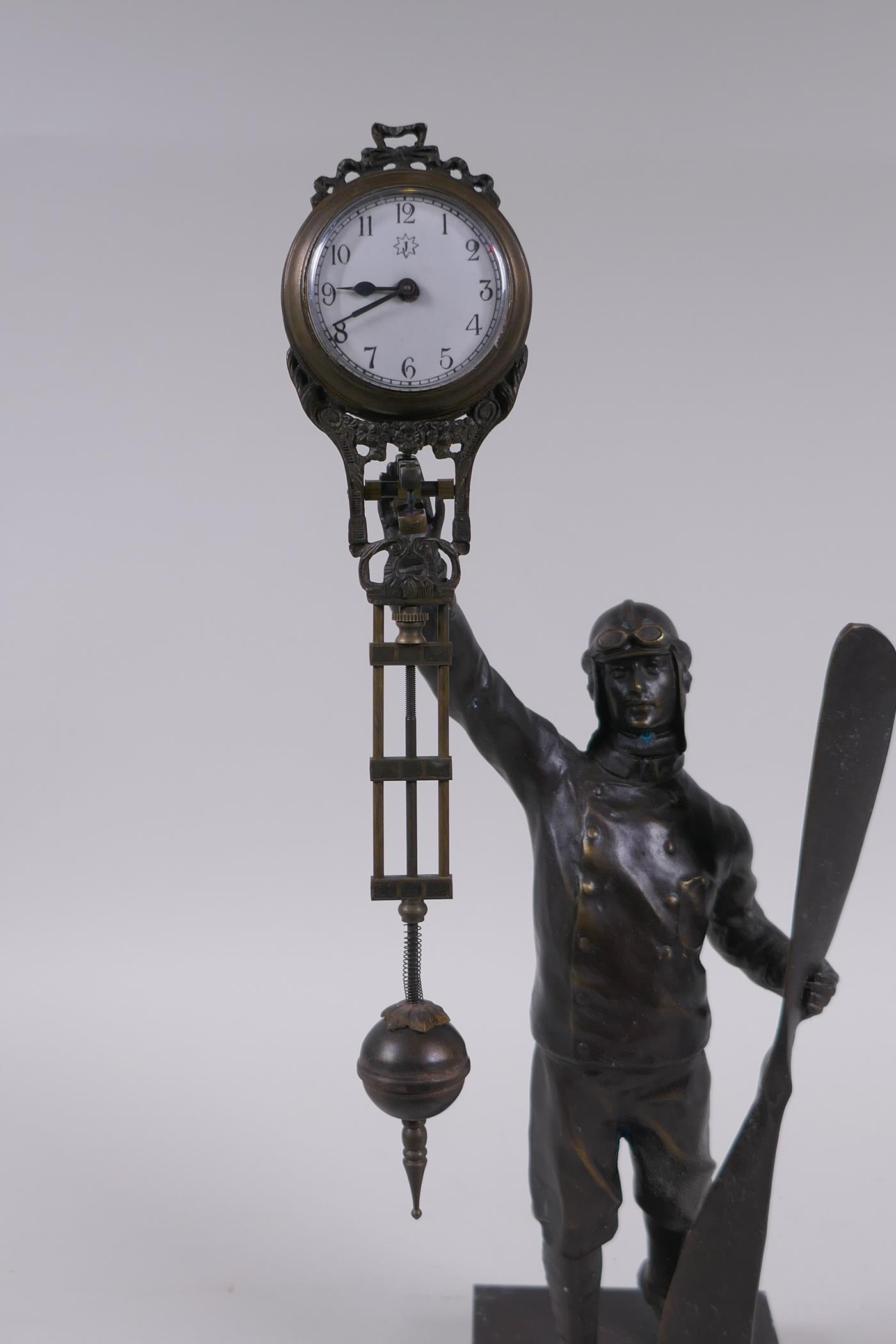 A brass and bronze Aviator mystery clock, 37cm high - Image 3 of 3