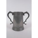 An antique twin handled pewter trophy for the Cambridge Caius College boat club senior trial eights,