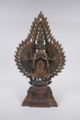 A Tibetan gilt bronze figure of a many armed Buddha, 40cm high