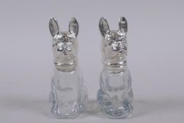 A pair of glass and silver plated salts in the form of pug dogs, 8cm high