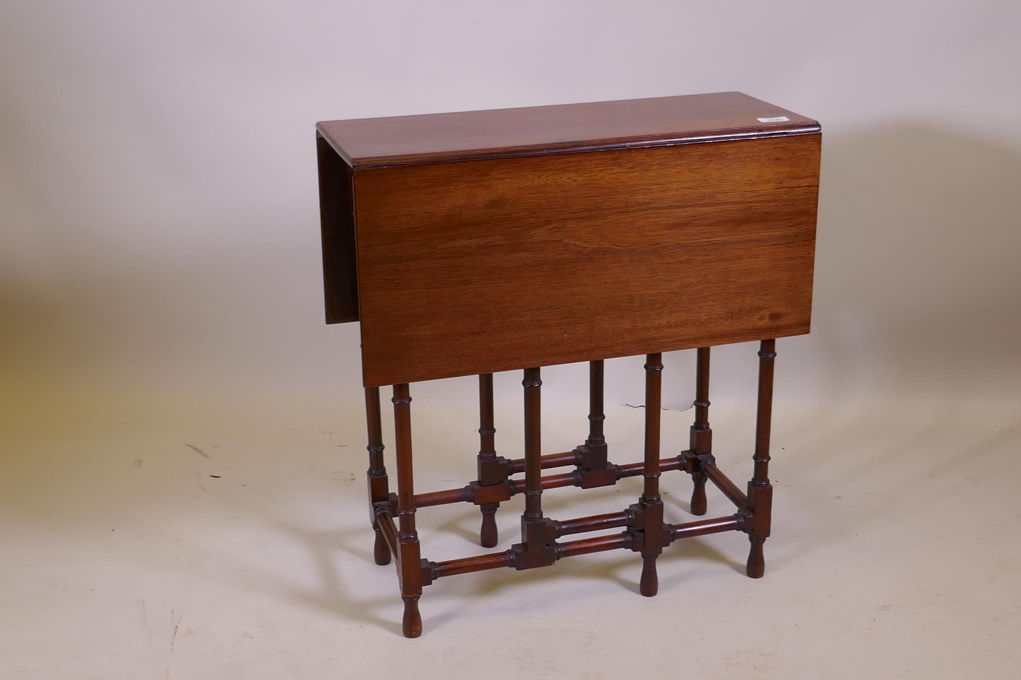A Victorian mahogany spider gateleg table on ring turned supports, 61 x 26cm, 66cm high, 61 x 78cm