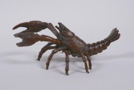 A Japanese style bronze okimono crayfish, impressed mark to tail, 10cm long