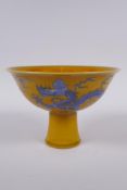 A Chinese yellow ground porcelain stem bowl with blue and white dragon decoration, Chenghua 6