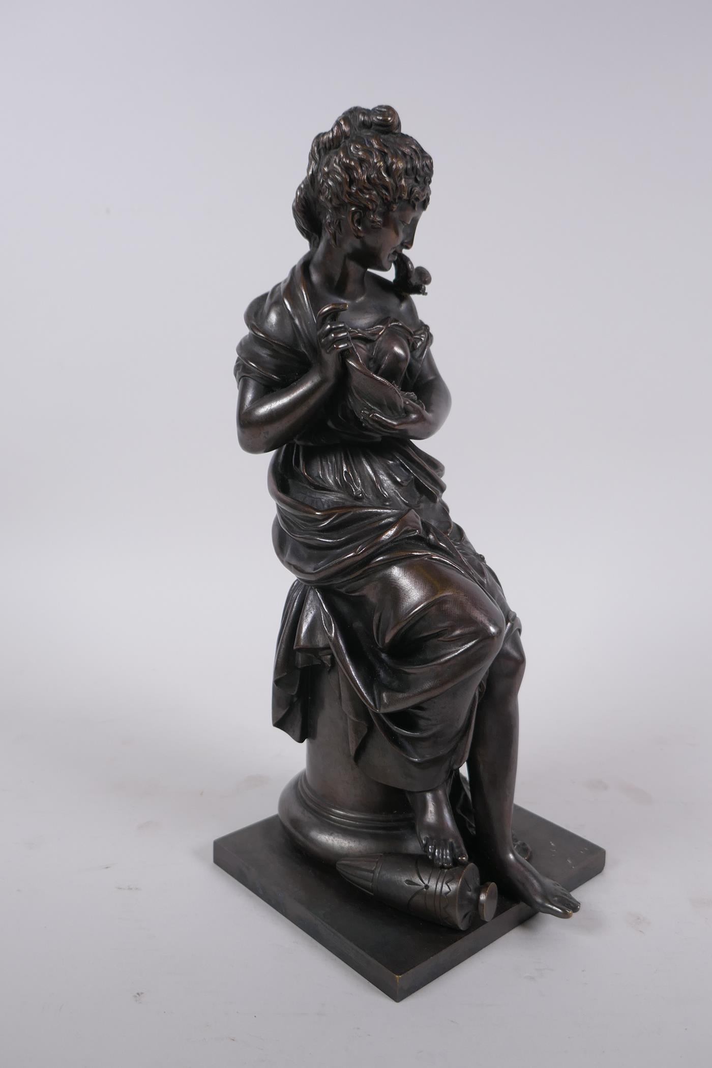 After Emile Bruchon, a late C19th/early C20th French bronze of a seated woman holding a nest of - Image 3 of 7