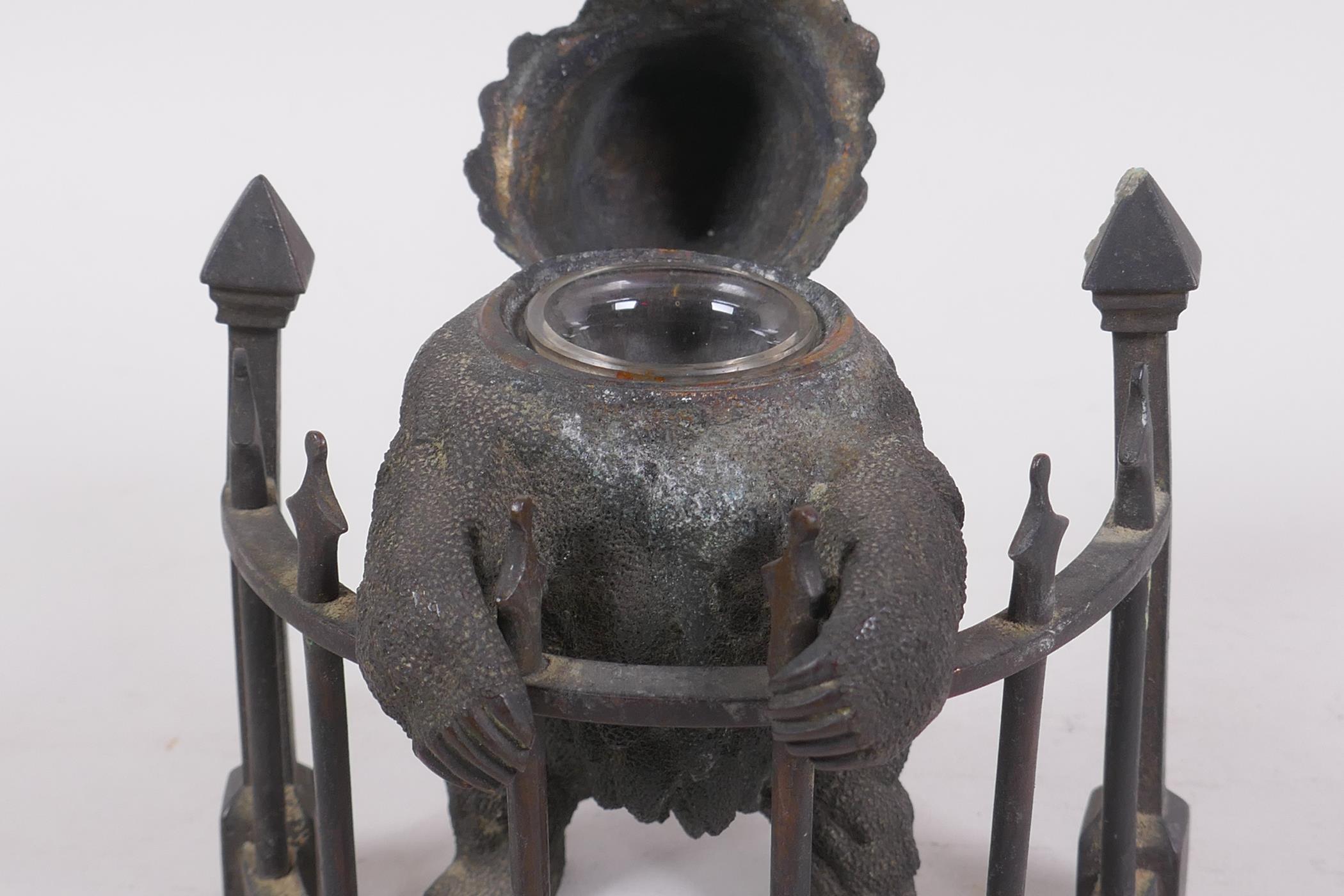 A C19th finely cast patinated bronze inkwell in the form of a bear behind railings, 12cm high - Image 6 of 7