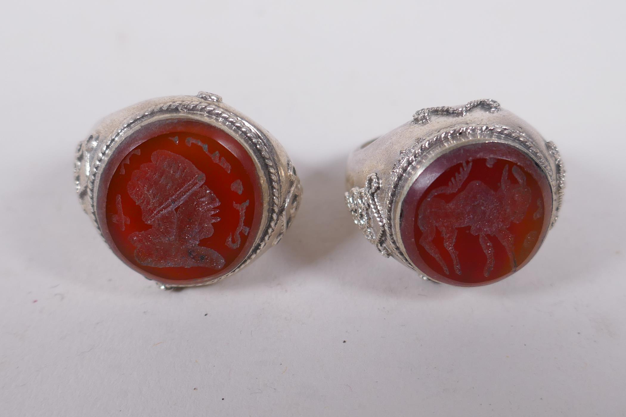 Two Islamic white metal intaglio rings and two similar pendants, largest 4cm diameter - Image 3 of 4