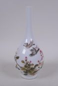 A C19th polychrome porcelain stem vase decorated with birds amongst branches in bloom, character
