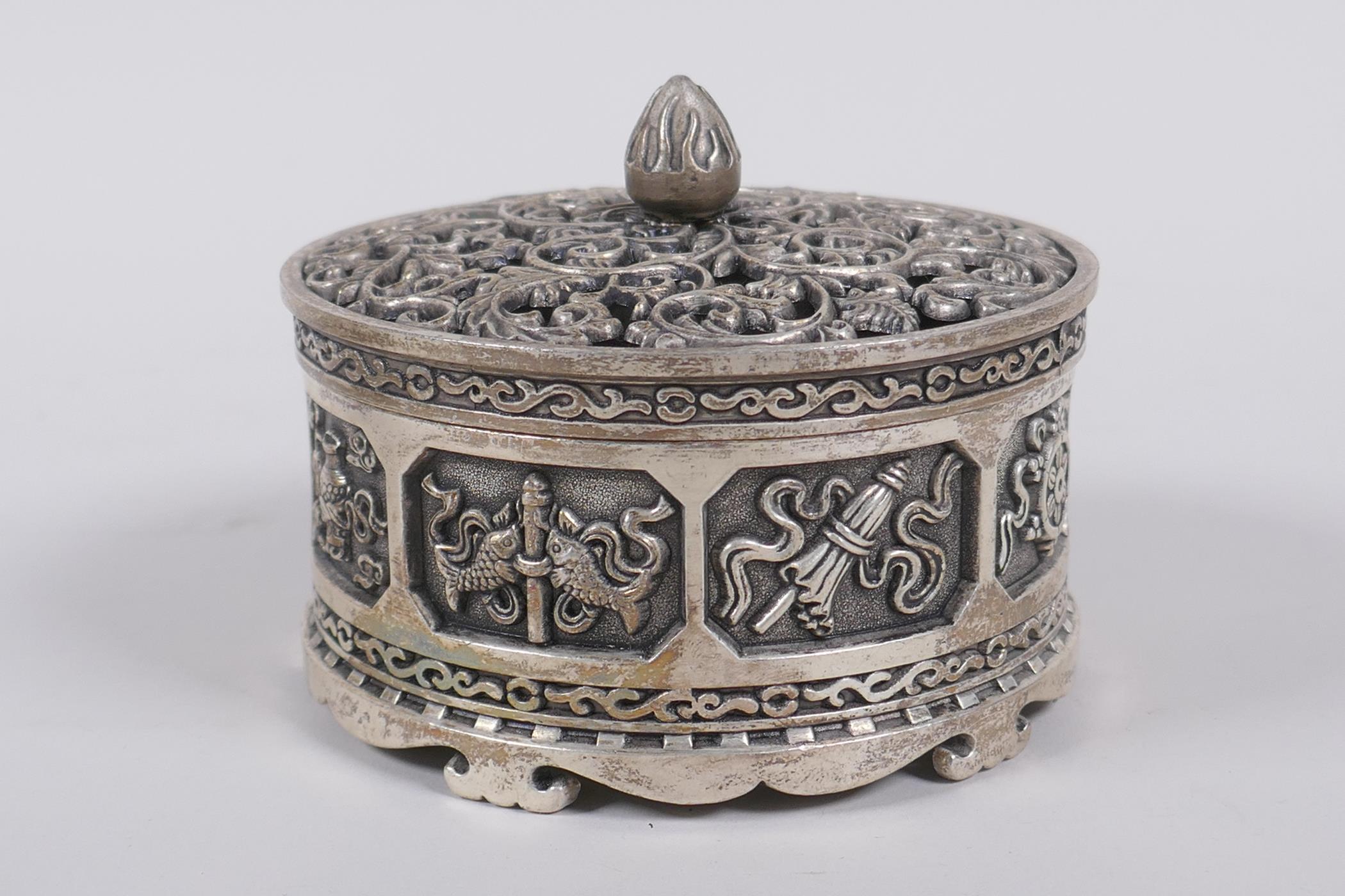 A Sino Tibetan white metal cylinder censer and cover, decorated with the emblems of the eight - Image 2 of 6
