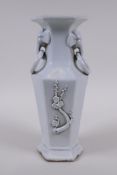 A Chinese blanc de chine porcelain vase of hexagonal form with two loop handles and raised prunus