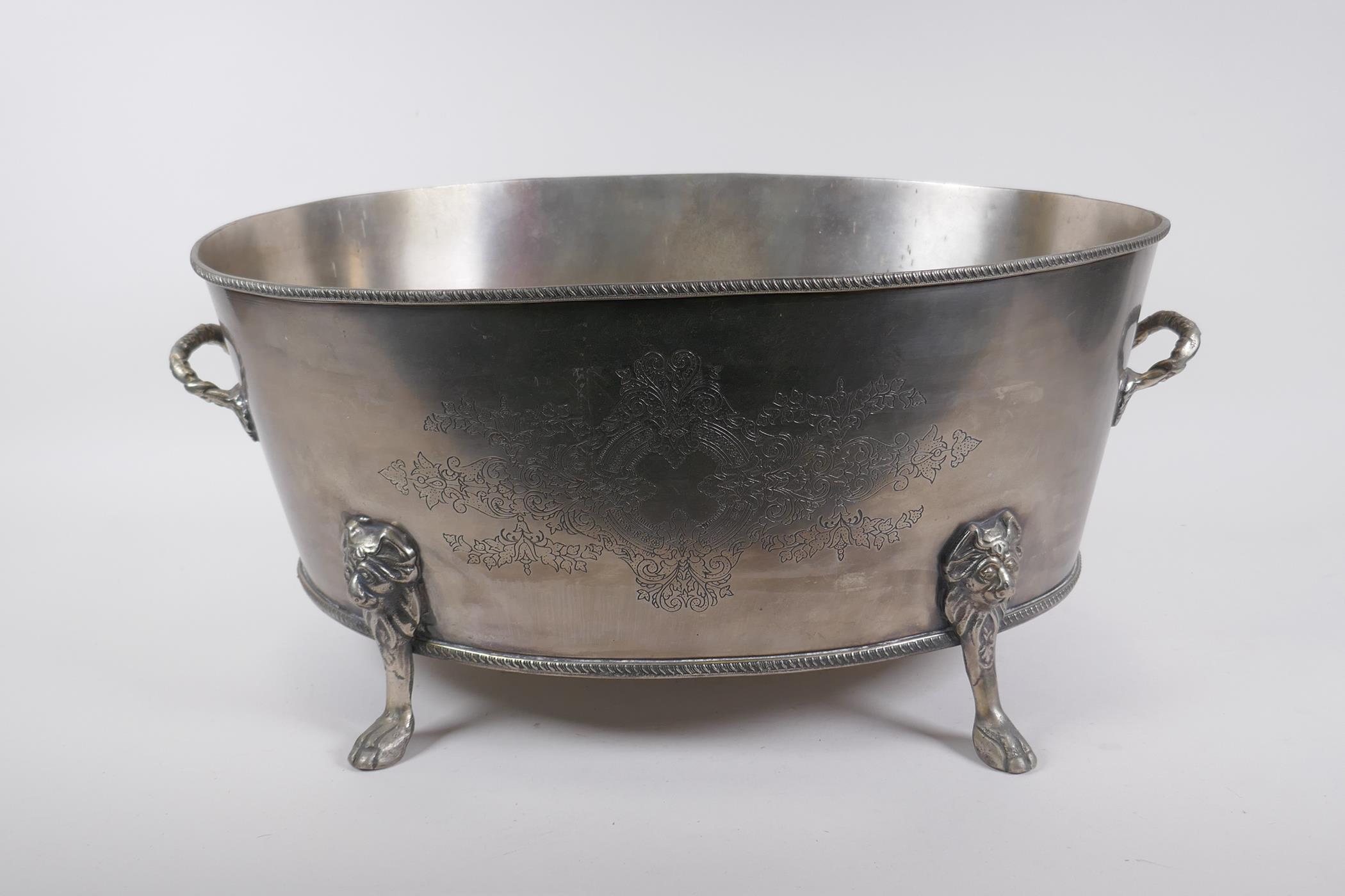 A silver plated champagne cooler with two handles, lion's mask and paw feet, 52 x 35cm, 24cm high - Image 2 of 5