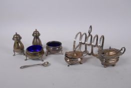 A hallmarked silver toast rack by James Deakin & Sons, Sheffield 1933, together with two other