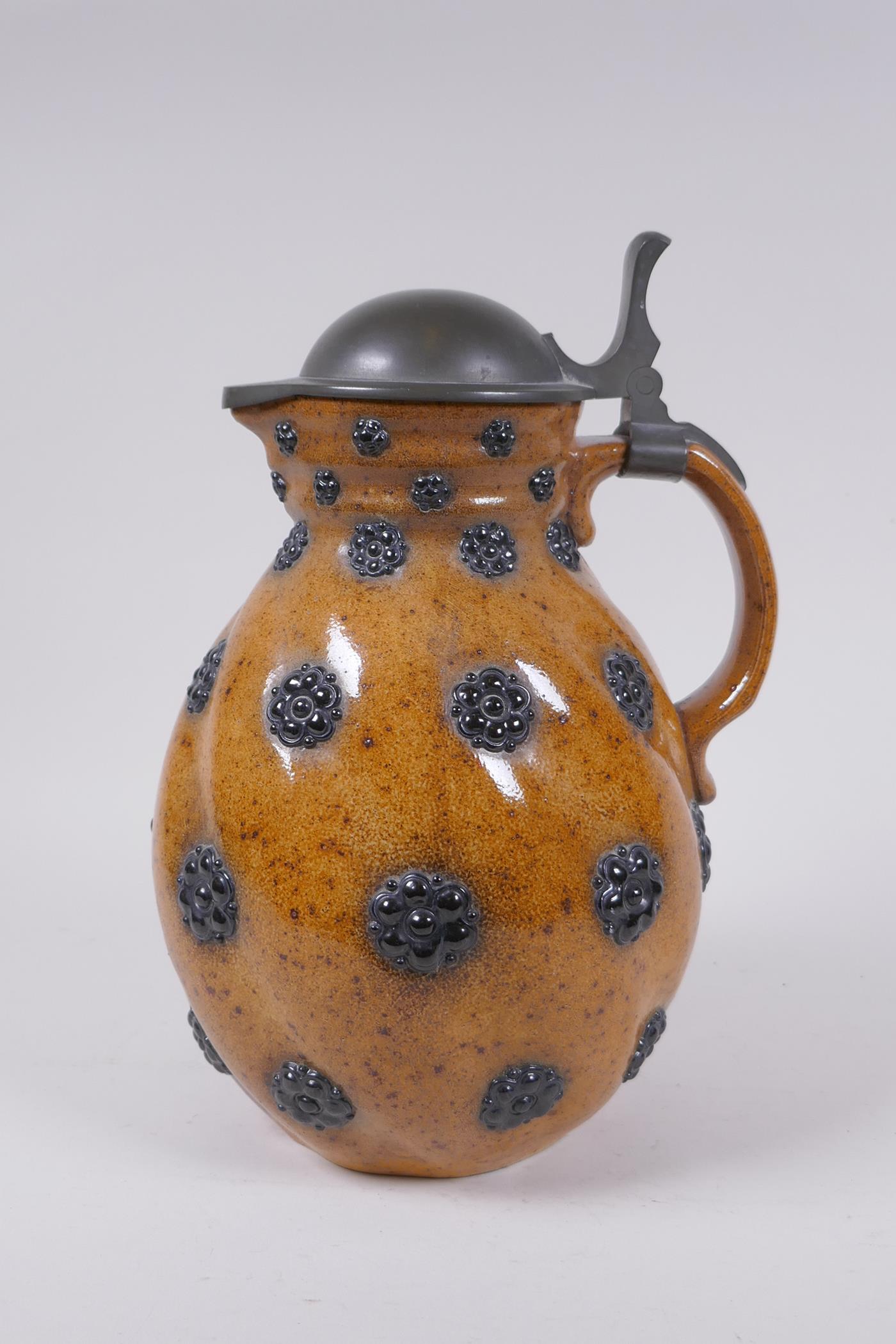 A German Reinheart Merkelbach stoneware art pottery pitcher of swirled form with applied floral - Image 4 of 8