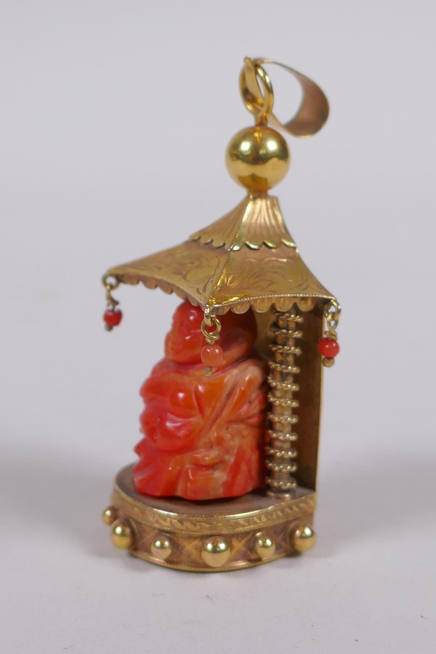 A 9ct gold pendant in the form of a shrine with carved coral figure of Buddha, 22.2g gross - Image 3 of 6