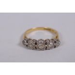 An 18ct yellow gold ring set with five old cut diamonds, 0.3ct, 3.8g gross