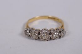 An 18ct yellow gold ring set with five old cut diamonds, 0.3ct, 3.8g gross