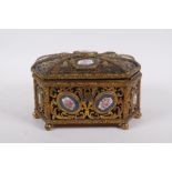A C19th French pierced ormolu jewellery casket with inset Sevres porcelain floral plaques and