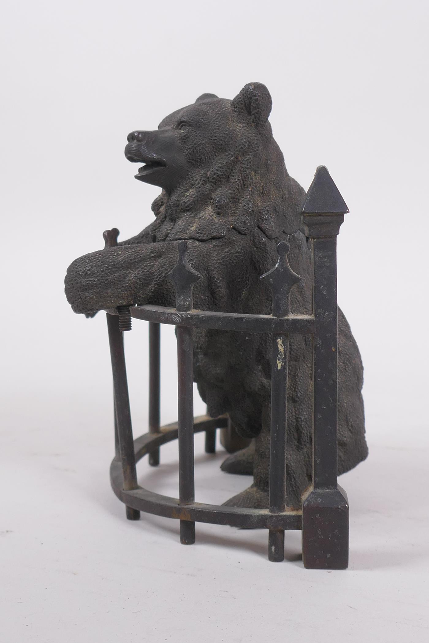 A C19th finely cast patinated bronze inkwell in the form of a bear behind railings, 12cm high - Image 3 of 7