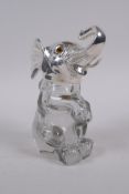 A silver plate and glass ink well in the form of an elephant, 14cm high
