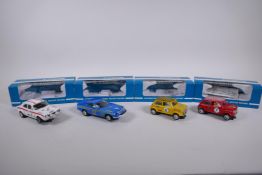 Four 1970s Scalextric cars to include two Mini Cooper C.007 in red and yellow, a Datsun 260Z C.053