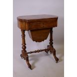 A Victorian inlaid walnut games table, the fold over top inlaid with a backgammon and chess board,