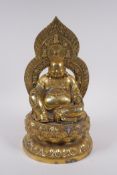 A Chinese gilt bronze figure of Buddha seated on a lotus throne, 4 character mark to base, 29cm high