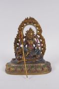 A Sino Tibetan painted bronze figure of a deity seated on a mythical creature, 4 character mark to