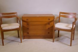 A mid century Danish teak chest of four long drawers with moulded cup handles, 87 x 40 x 66cm, and a