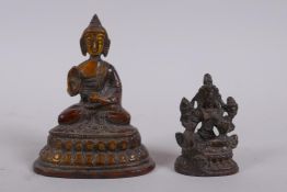 A Sino Tibetan bronze figure of Buddha, and a smaller bronze figure of a female deity, largest 9cm