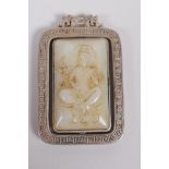 A Chinese white metal and jade set pendant with revolving panel depicting buddha, 6cm x 4cm