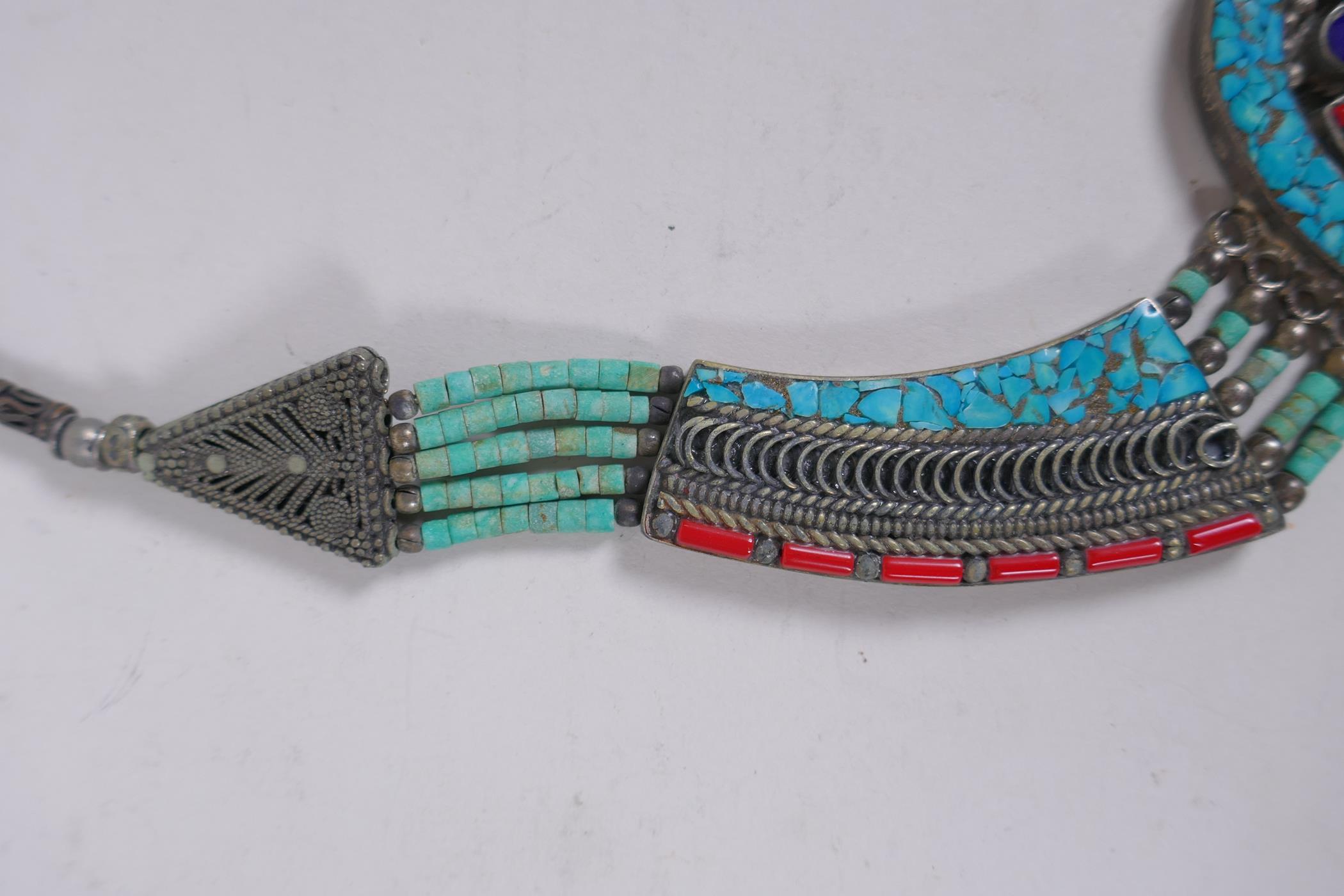 A Tibetan white metal necklace set with turquoise shards and coral, 40cm long - Image 3 of 4