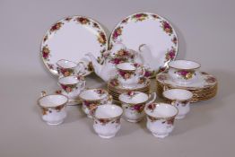 A Royal Albert Country Rose eight place tea service with two serving plates