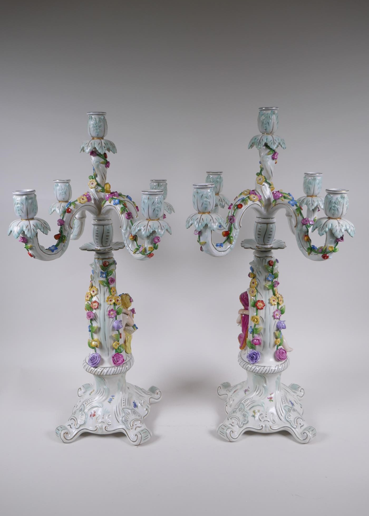 A pair of continental porcelain four branch candelabra decorated with putti, 59cm high - Image 8 of 8