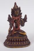 A Tibetan bronze figure of Buddha seated on a lotus throne, 10cm high