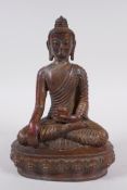 A Sino Tibetan gilt bronze figure of Buddha, 20cm high