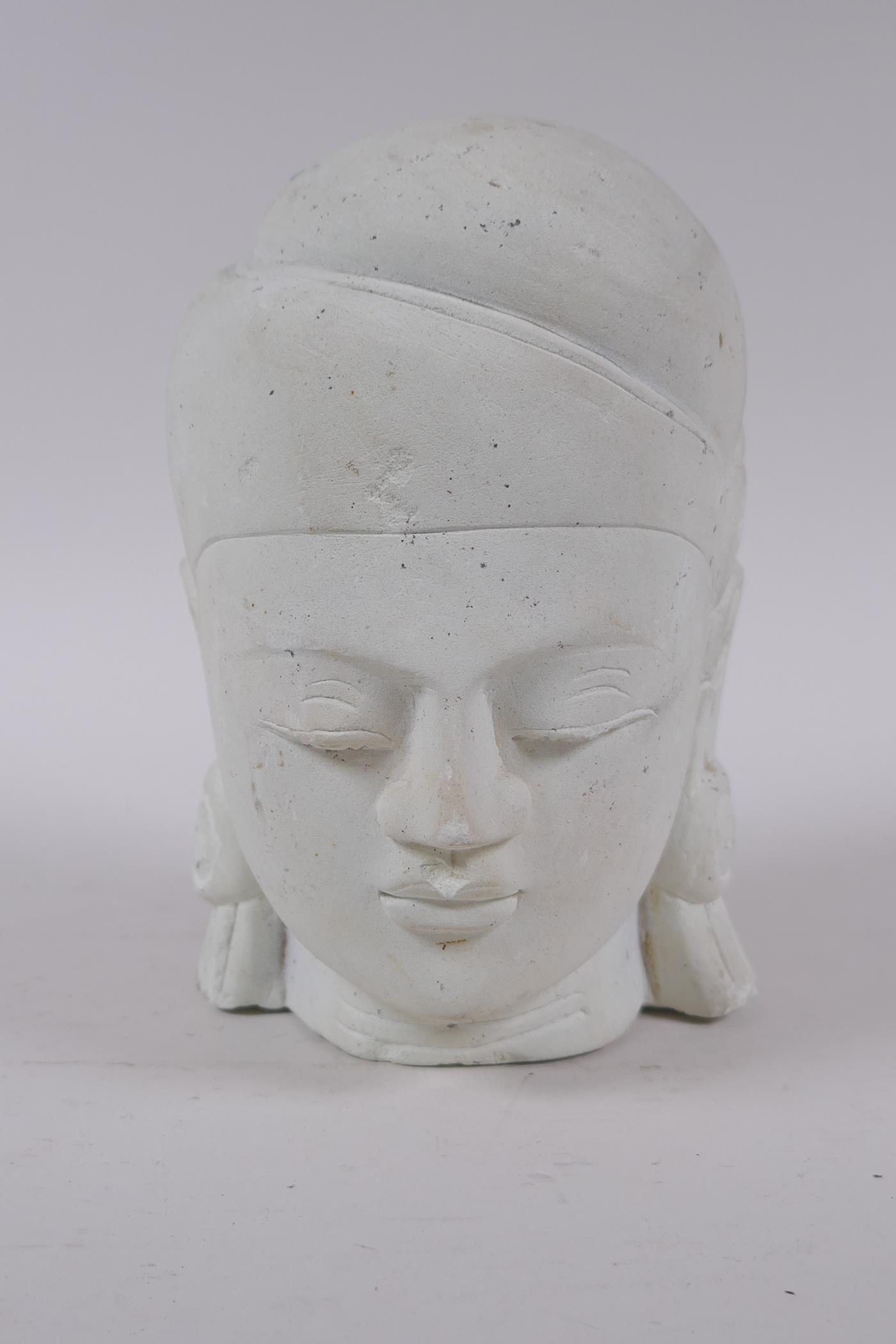 An Indian plaster head bust of Buddha, 17cm high