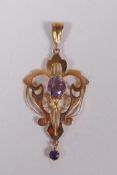 A 9ct gold Art Nouveau style pendant set with an amethyst, 3cm long, 1.8g