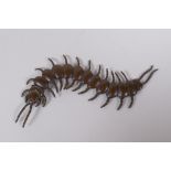 A Japanese jizai style bronze okimono centipede with articulated segments, 15cm long