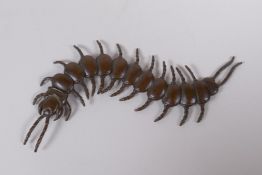 A Japanese jizai style bronze okimono centipede with articulated segments, 15cm long