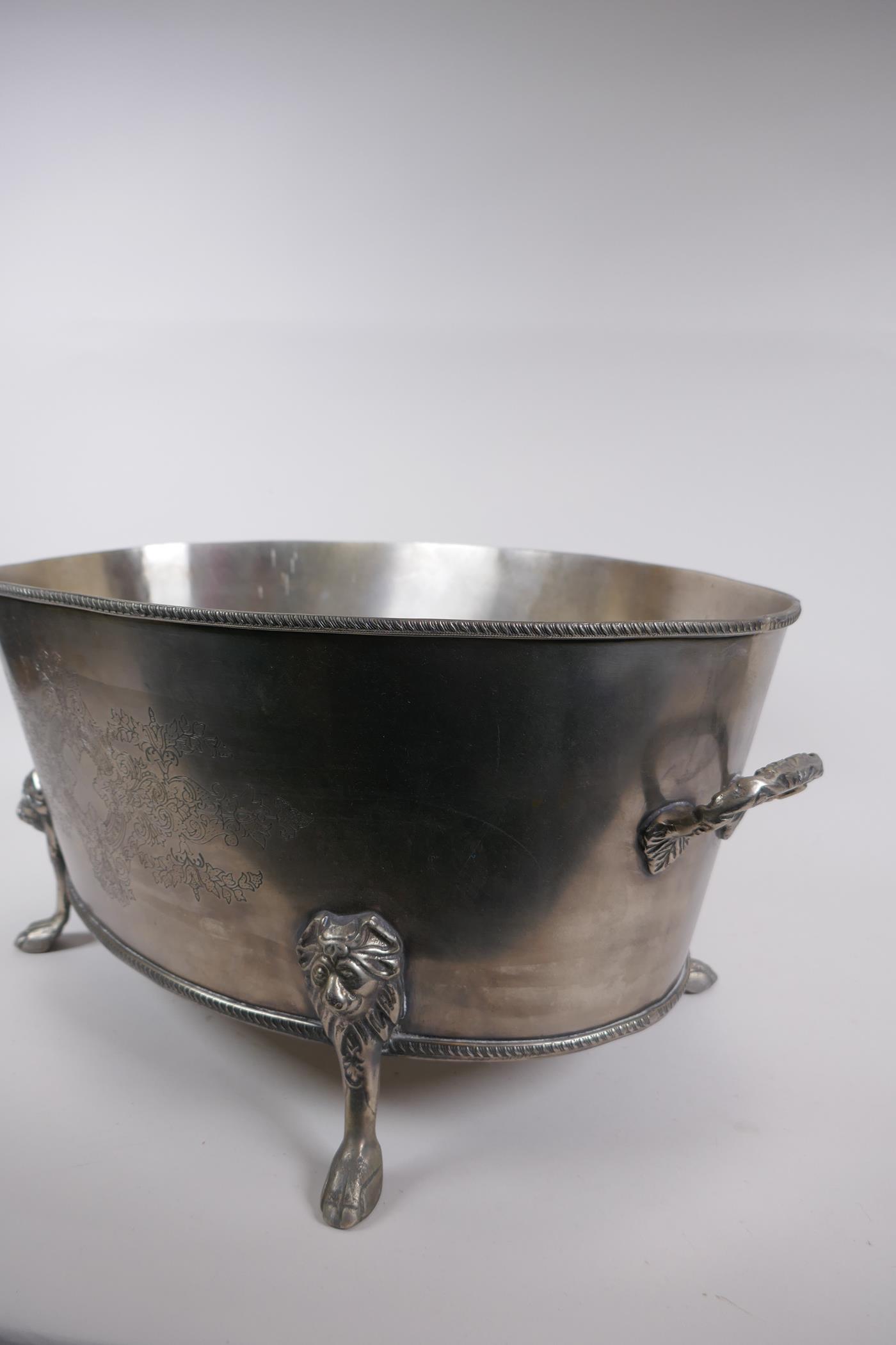 A silver plated champagne cooler with two handles, lion's mask and paw feet, 52 x 35cm, 24cm high - Image 4 of 5