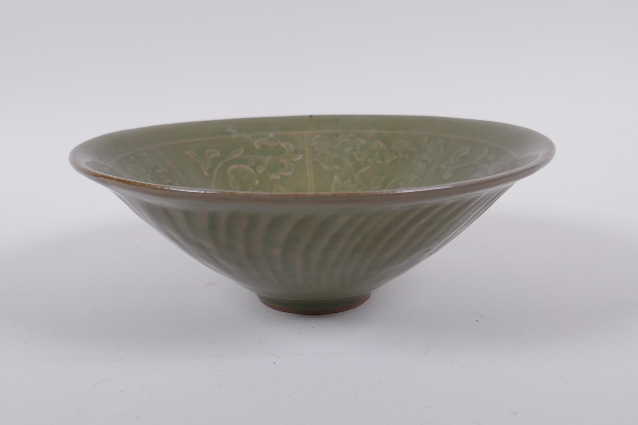 A Chinese Song style olive glazed pottery conical bowl, with underglaze figural decoration to the