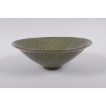 A Chinese Song style olive glazed pottery conical bowl, with underglaze figural decoration to the
