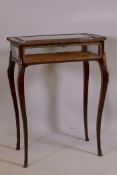 A C19th French mahogany bijouterie cabinet with ormolu mounts, shaped legs and scrolled sabots, 60 x