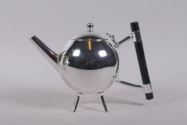 A Christopher Dresser style silver plated teapot, 20cm long