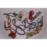 A string of agate beads, glass beads, enamelled and other necklaces