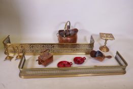An antique pierced brass fire fender and another smaller, together with a collection of copper,