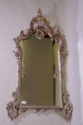 A Venetian carved wood wall mirror with silver leaf decoration, AF losses