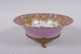 A continental Sevres style pink ground porcelain dish with floral decoration, gilt highlights and