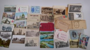 A large quantity of late C19th and C20th postcards and souvenir picture albums, including many
