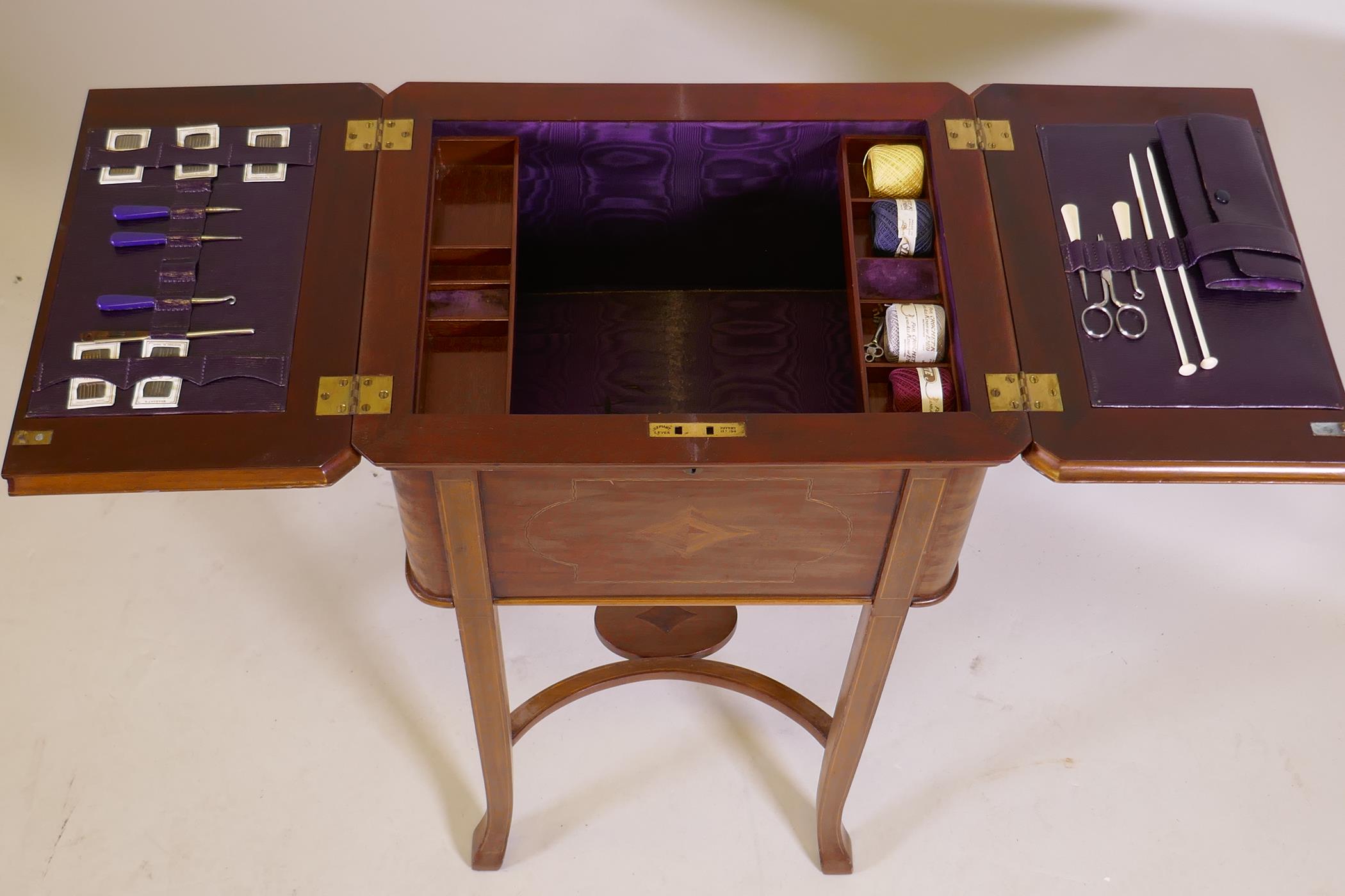 An Edwardian inlaid mahogany work table, the fold over top opening to reveal a fitted interior - Image 2 of 8